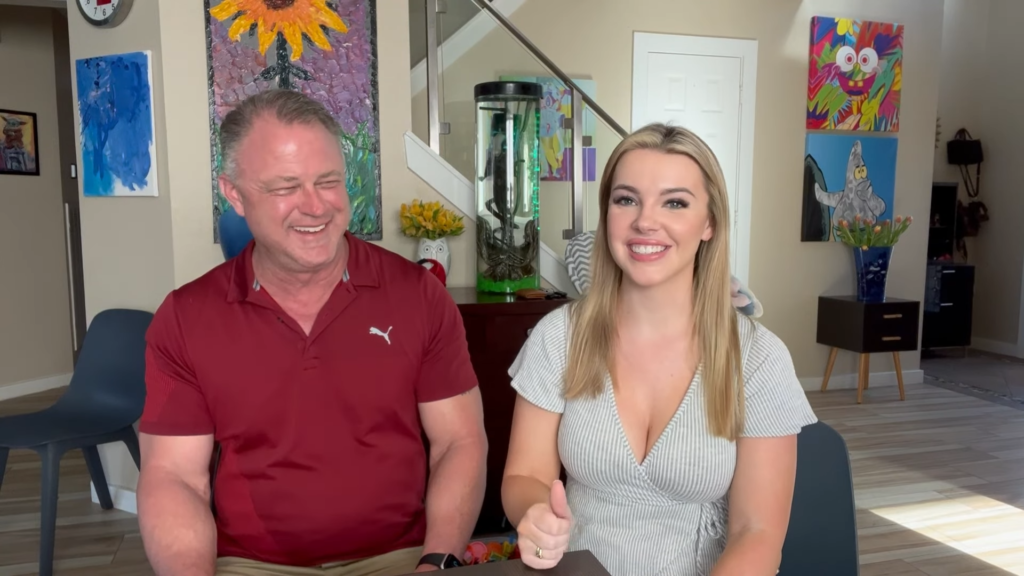 Marie Dee sitting next to her father, Steve Davis, in a still frame taken from their family Q&A video.